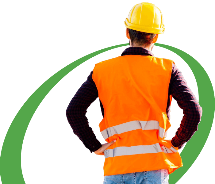 A construction worker stands with hands on hips, facing away from the camera. They are wearing an orange safety vest, yellow hard hat, and blue jeans. A green swoosh graphic wraps partially around them from behind, highlighting the social impact they contribute to through their work.